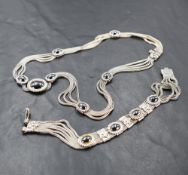 A 925 grade white metal and hematite necklet and bracelet set, comprised of multiple chains fused by