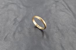 A yellow metal wedding band, marked 333, size U and approx 2.7g