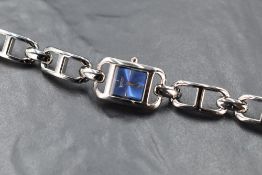 A ladies DKNY wristwatch with blue rectangular dial, sold with branded frosted plastic box