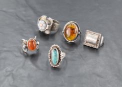 A Scottish silver and agate dress ring, with oval agate cabochon between open stylised shoulders,
