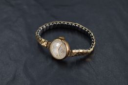 A lady's vintage Tudor 9ct gold wrist watch having Arabic numeral dial with subsidiary seconds to