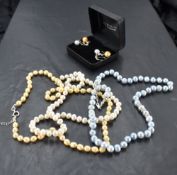 Three strings of cultured baroque pearls including dyed baby blue and lemon, two pairs with matching