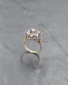 A sapphire and diamond chip multi cluster ring in a claw set mount on a 9ct gold loop, size P & 4.