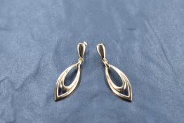 A pair of 9ct gold stud earrings, with pierced elliptical drop, 2.8grams