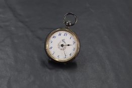 A small Victorian silver key wound poicket watch having blue Arabic numeral dial to white enamel