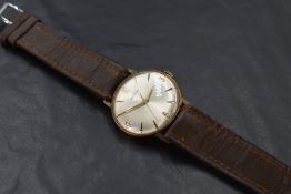 A gent's yellow metal watch by Roamer having Arabic numeral and baton dial to champagne face in