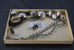 Five pairs of white metal/silver stud earrings of stylised form, a similar ring and a white metal