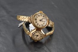 Two ladies 9ct gold wrist watches, both having Arabic numeral dials and gold plated stretch straps
