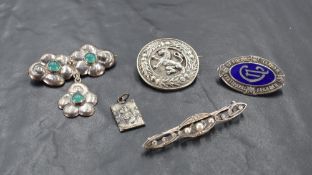 A small selection of HM silver and white metal brooches including Scottish lion passant, College