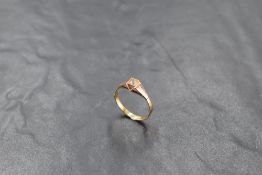 A 14ct gold white stone set ring, the shank marked 585, ring size P, 1.7grams