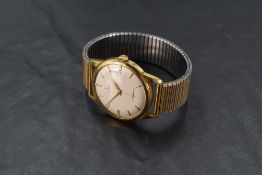 A vintage gilt-metal cased Gent's Omega wristwatch, the champagne dial with baton hour markers and