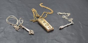 Three silver pendants including lace bobbin and Ingot with oversized hallmarks