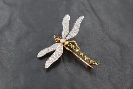 An 18ct white and yellow gold dragonfly brooch, the wings pave-set with small diamond brilliants the