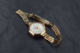A lady's 9ct gold wrist watch by Limit having Arabic numeral dial with subsidiary seconds to