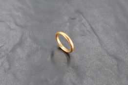 A 22ct gold wedding band, ring size L, 5.3grams