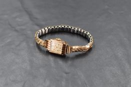 A lady's vintage 9ct gold wrist watch by Majar, with baton and Arabic markets, between an expandable