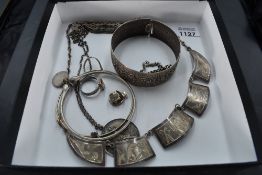 Nine pieces of silver and white metal jewellery including Egyptian style necklace, St Christopher