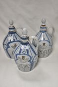 Three Scottish Buchan stoneware flagons, labelled for sherry, gin and port.