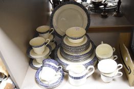 A Minton 'Mandeville' partial dinner service having cream ground with blue band and foliate details,