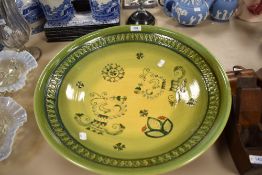 A 20th century large studio pottery charger decorated in a Portuguese design signed possibly reading