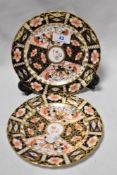 Two 1920s Royal Crown Derby plates decorated in the Imari palette.