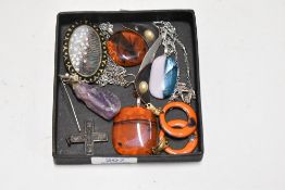 A selection of modern art glass pendants, a crucifix and two pairs of earrings