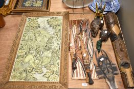 A painted canvas depicting Tibetan or similar scene, two tribal masks, two treen elephants, two