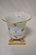 A Herend porcelain footed vase having floral and gilt heightened decoration.