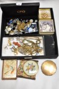 A selection of vintage costume jewellery and compacts, included are brooches, necklaces, stick pin