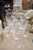 A set of eight nice quality modern glass goblets and seven champagne flutes