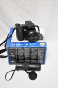 A Konica Minolta Dimage A2 in box as found for spares and repairs and a Viking 8x42 ED-M lens.