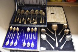 A selection of vintage flatware in boxes, knives and forks, spoons and sugar nips to be included.