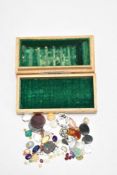 A small box of mixed gem stones.