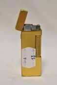 A mid century Dunhill brass lighter, having GHC engraved to cap.