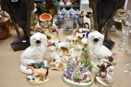 A selection of Victorian and later Staffordshire flatbacks and pair of similar spaniels.