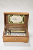 A mid century Swiss made wooden music box.