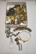 A variety of silver and gold tone chains, to include fancy link and rope examples.