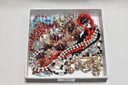 A small selection of mainly vintage costume jewellery necklaces including glass bead, yellow metal