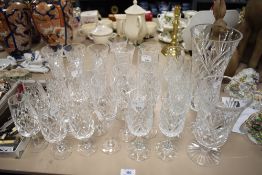 A selection of glassware, including Royal Doulton wine glasses, vases and champagne flutes.