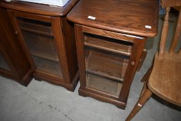 A pair of modern narrow oak display or entertainment cabinets