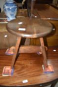 An Arts and Crafts style stool, with pegged joints (one peg missing)