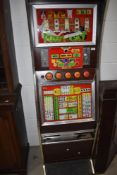 A 1980's Fruit Machine, Pussy Cat, 10p per play, height 180cm, width 55cm, we don't test for