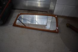 A vintage teak mirror