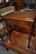 A modern hardwood occasional table in the period style, width approx. 56cm