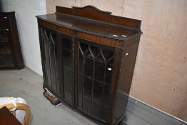 A late 19th or early 20th Century mahogany display cabinet , leg AF