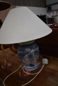 A reproduction blue and white ceramic table lamp