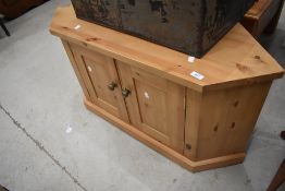 A modern pine corner TV unit