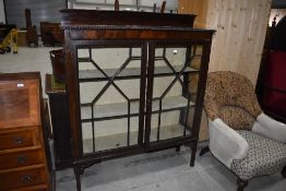 A late 19th/early 20th Century astral glazed display having gadrooned edge