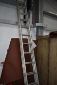 A set of aluminium extending ladders