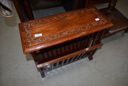 A Oriental hardwood magazine rack